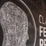 A chalkboard with the CHFP logo on it.