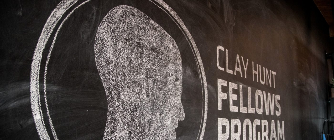 A chalkboard with the CHFP logo on it.