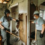 Greyshirts take out drywall as they Clean Up After a Flood