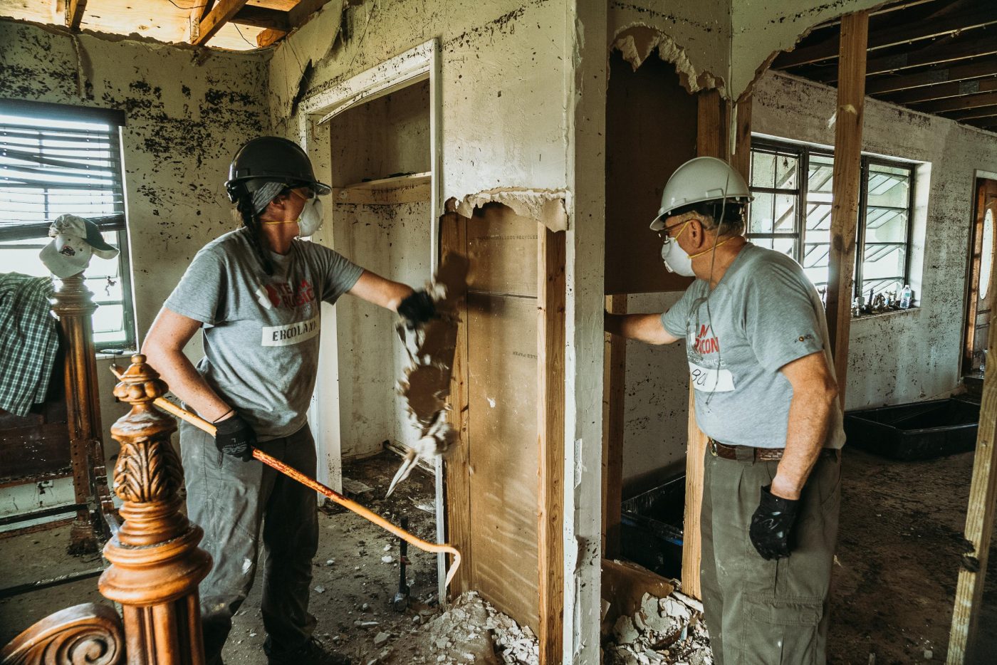 Greyshirts take out drywall as they Clean Up After a Flood