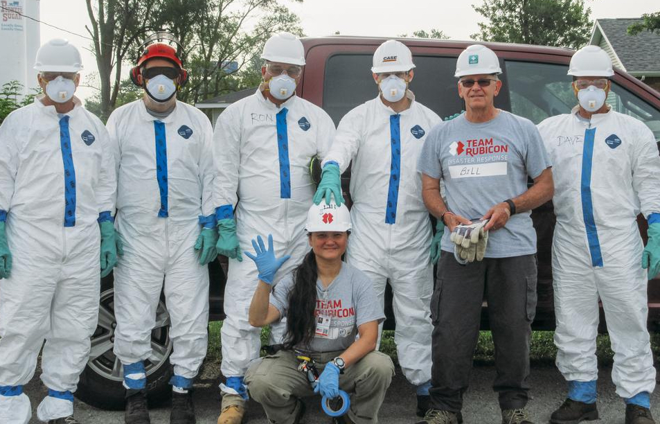 volunteers in Tyvek practice flood cleanup safety